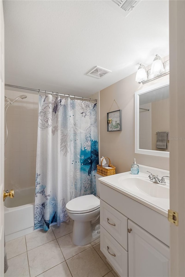 full bathroom with tile patterned flooring, shower / tub combo, vanity, and toilet