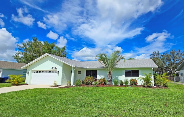 single story home with a garage and a front lawn