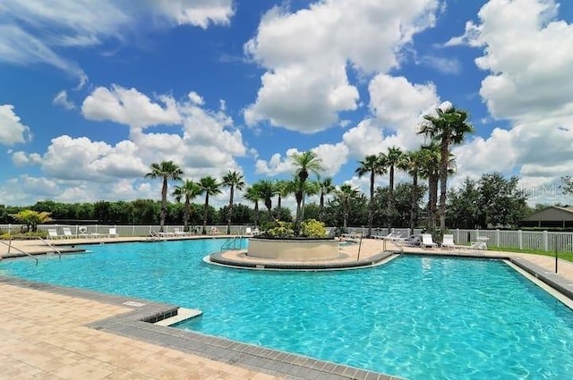 view of pool featuring a patio area