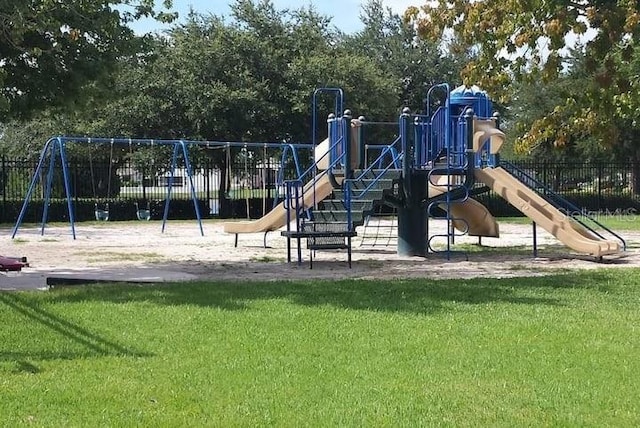 community playground with fence and a yard