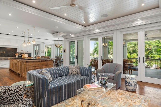 501 Harbor Point Rd, Longboat Key, FL 34228 - living area featuring french doors, a ceiling fan, dark wood-style floors, and crown molding