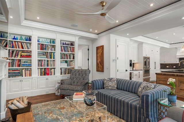 living room with ceiling fan, a raised ceiling, wood ceiling, ornamental molding, and hardwood / wood-style floors