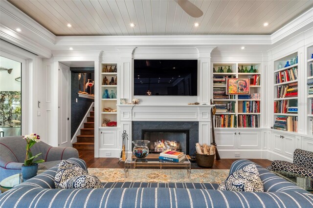 living room with a fireplace, dark hardwood / wood-style floors, ornamental molding, and wood ceiling