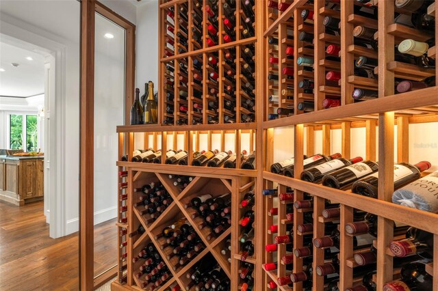 501 Harbor Point Rd, Longboat Key, FL 34228 - wine area with wood finished floors, recessed lighting, and baseboards