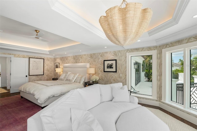 bedroom featuring access to outside, a tray ceiling, crown molding, and ceiling fan