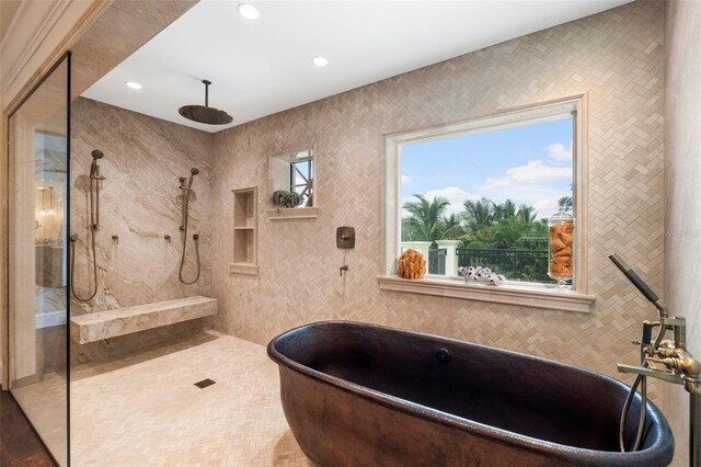 bathroom with shower with separate bathtub