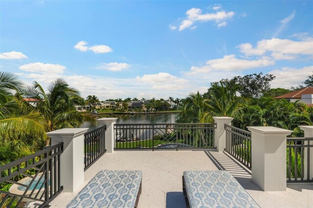 501 Harbor Point Rd, Longboat Key, FL 34228 - view of patio / terrace featuring a water view and a balcony