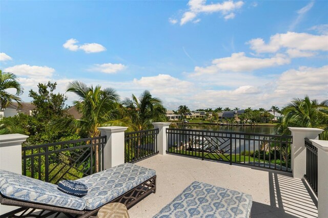 501 Harbor Point Rd, Longboat Key, FL 34228 - view of patio with a water view and a balcony