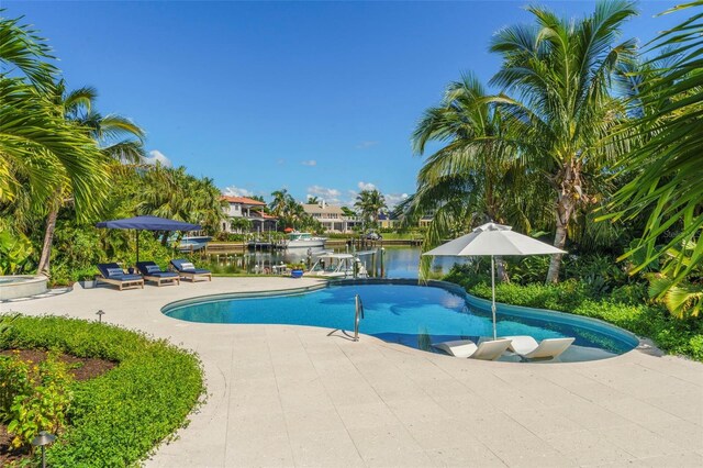 501 Harbor Point Rd, Longboat Key, FL 34228 - outdoor pool with a patio area and a water view