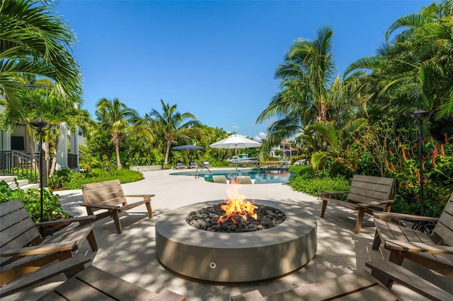 view of patio with an outdoor fire pit