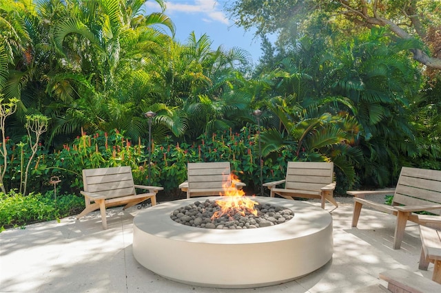 view of patio / terrace featuring an outdoor fire pit