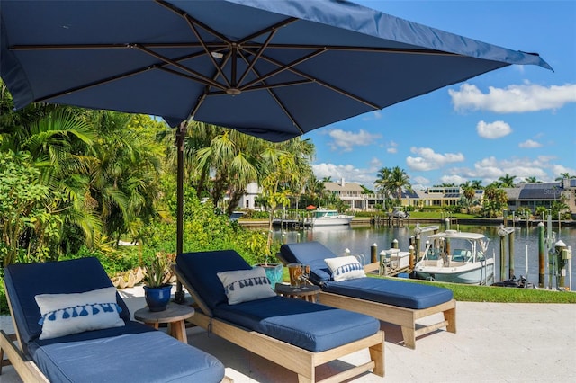 view of patio featuring a boat dock and a water view