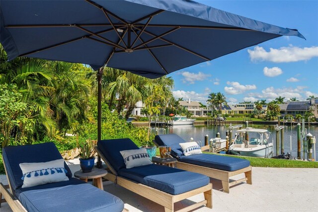 501 Harbor Point Rd, Longboat Key, FL 34228 - view of patio featuring a water view, a boat dock, and boat lift
