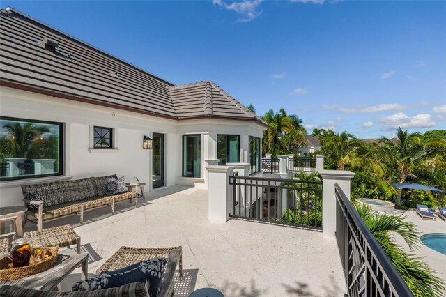 501 Harbor Point Rd, Longboat Key, FL 34228 - view of patio with an outdoor living space and an outdoor pool