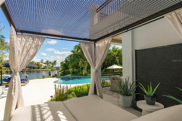 view of patio with a water view