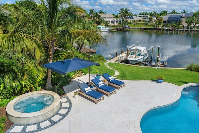 view of pool featuring a dock, a water view, a yard, and a patio