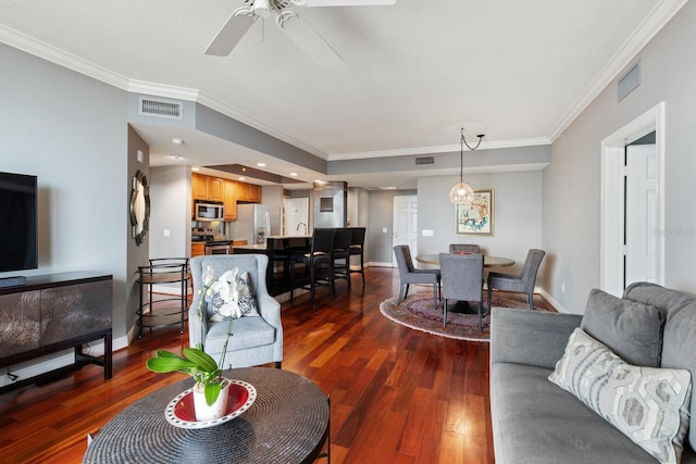 living room with ceiling fan, crown molding, and dark hardwood / wood-style flooring