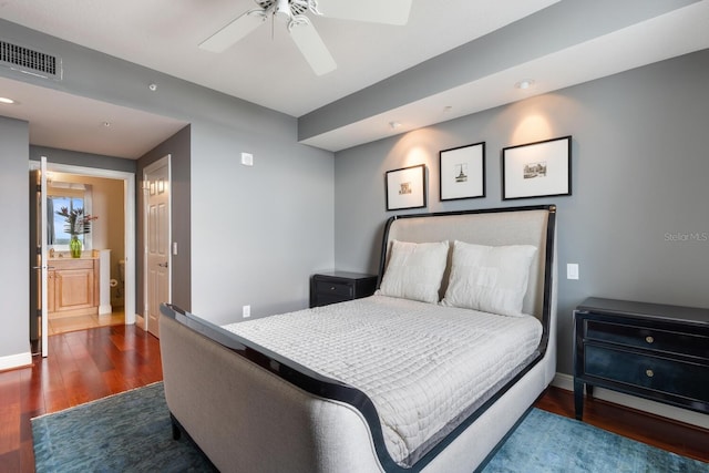 bedroom with wood-type flooring, ceiling fan, and ensuite bathroom