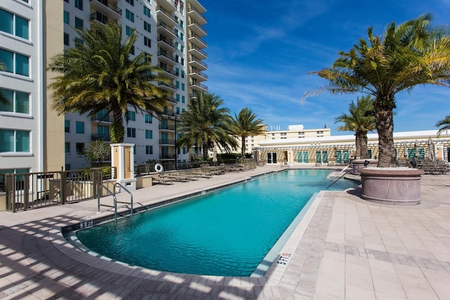 view of swimming pool with a patio