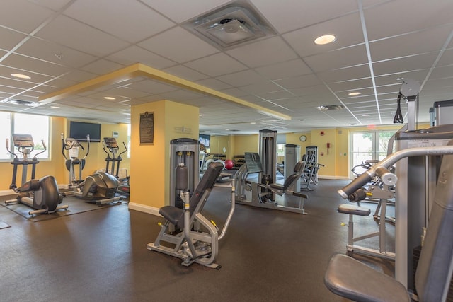 exercise room with a drop ceiling