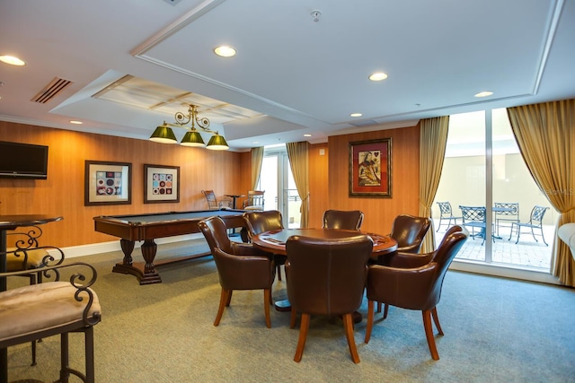 recreation room with carpet floors, a raised ceiling, and wooden walls