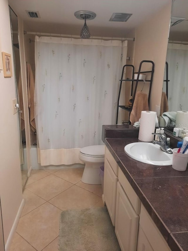 full bathroom with vanity, toilet, shower / bathtub combination with curtain, and tile patterned floors