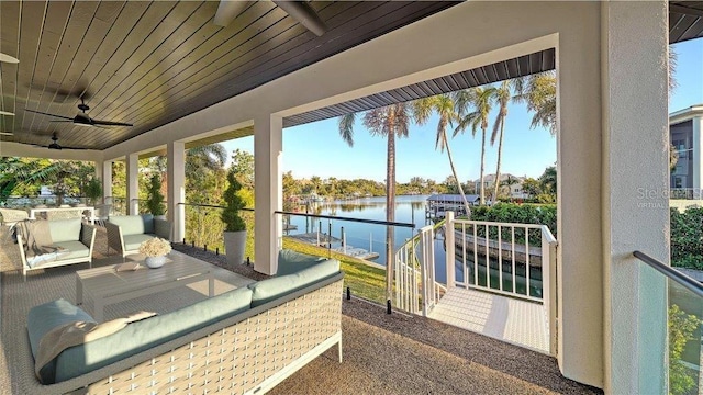 exterior space with a water view, wooden ceiling, and ceiling fan