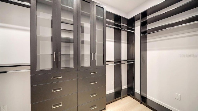 walk in closet featuring light wood-type flooring