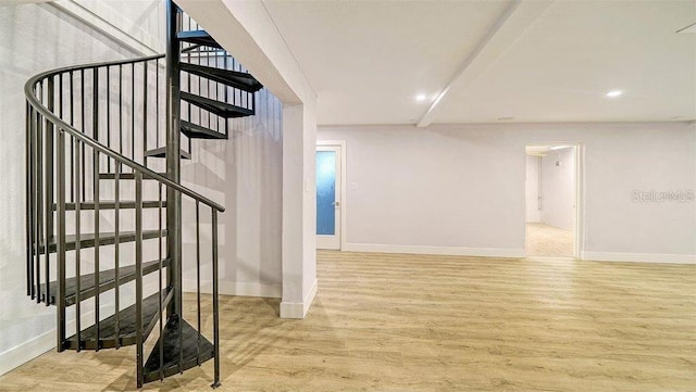 stairs with hardwood / wood-style flooring