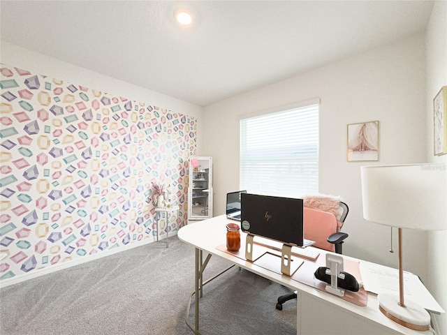 carpeted office featuring vaulted ceiling