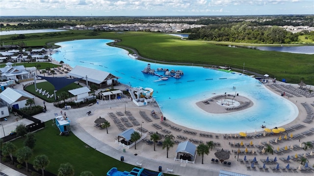 birds eye view of property with a water view