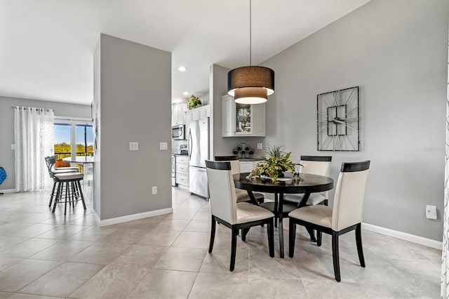 dining room with light tile patterned flooring