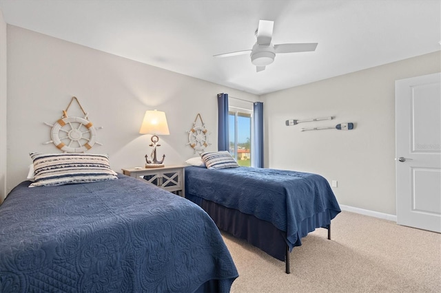 bedroom featuring baseboards, ceiling fan, and light carpet
