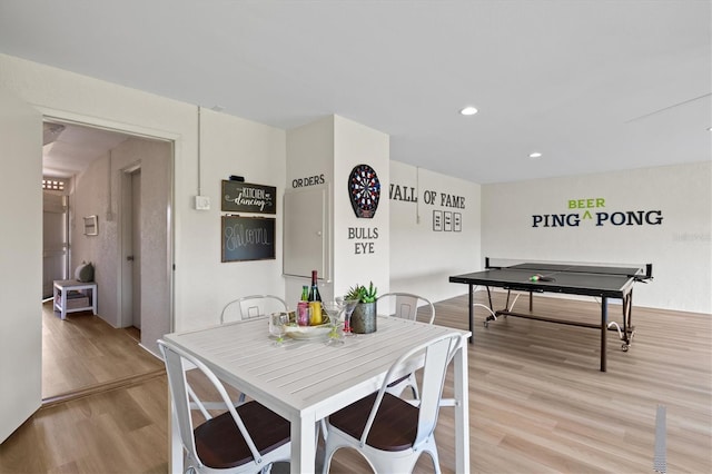 dining space featuring recessed lighting and light wood-type flooring