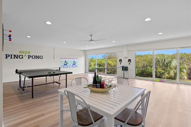 dining room with recessed lighting, a ceiling fan, and light wood finished floors