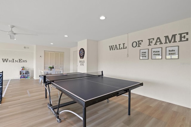 playroom featuring ceiling fan and light hardwood / wood-style flooring