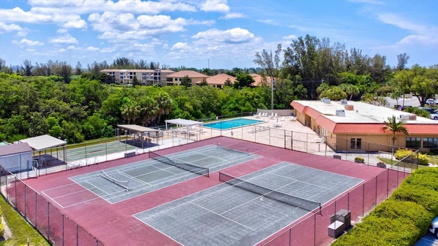 view of tennis court with fence