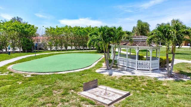 view of property's community with a lawn and a gazebo
