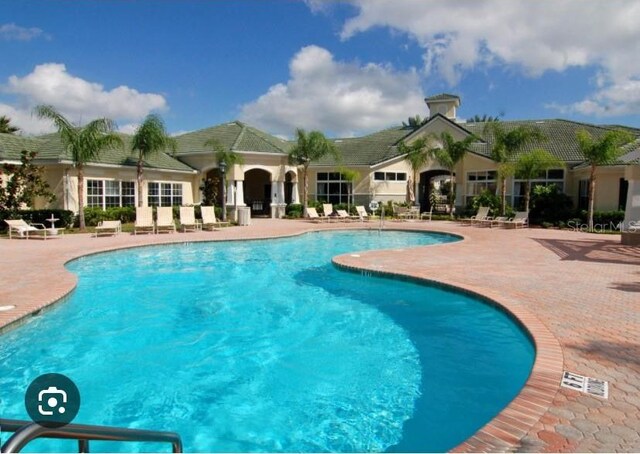 pool with a patio area