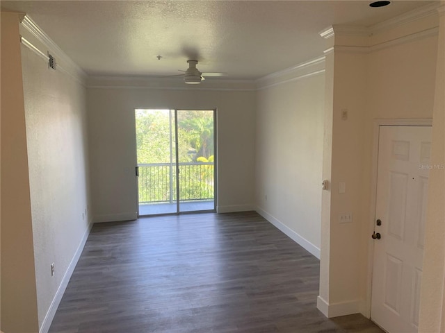 empty room featuring baseboards, dark wood-style flooring, and crown molding