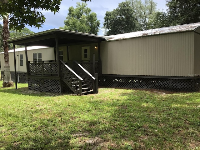 rear view of house with a yard