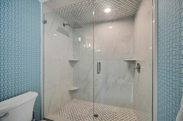 bathroom with toilet and walk in shower