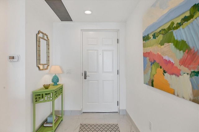 entryway with light tile patterned flooring