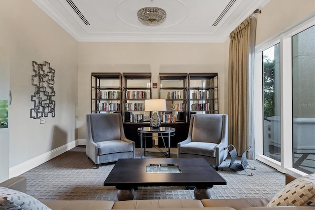 living area featuring crown molding