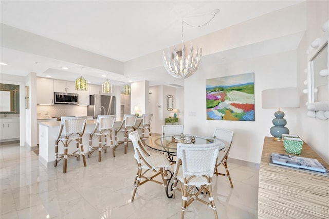 dining space featuring a notable chandelier