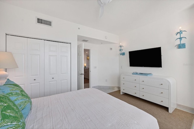 bedroom with carpet flooring and a closet