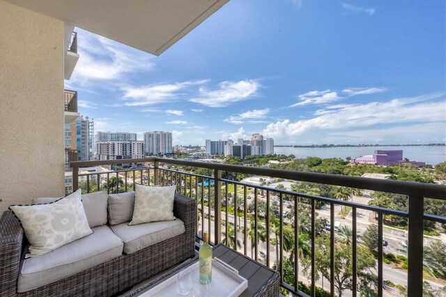 balcony featuring a water view