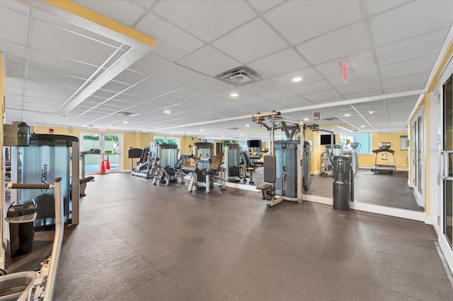 workout area featuring a paneled ceiling