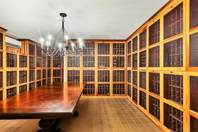 wine cellar featuring a wall unit AC, tile patterned flooring, and an inviting chandelier