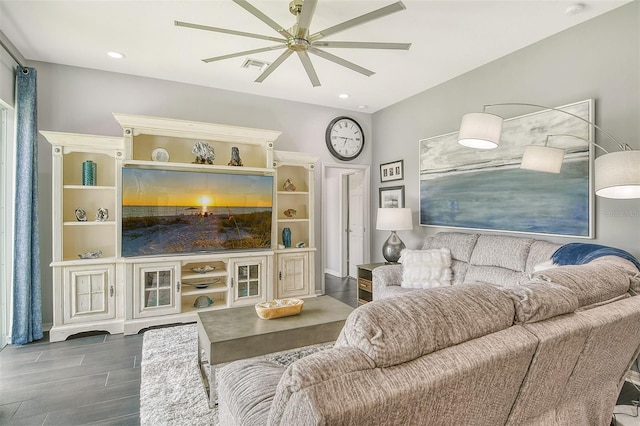 living room with hardwood / wood-style floors and ceiling fan